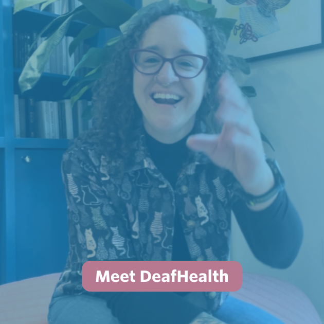 The video thumbnail features a blue overlay with a text bubble in the center that reads “Meet DeafHealth” in white text on a rose-colored background. A white non-binary person with shoulder-length curly hair sits on a burnt orange ottoman in front of a large bird of paradise plant placed in the corner of the room. The corner is styled with cobalt blue bookshelves and a white wall, which displays a framed artwork resembling abstract plant forms. Bee is signing 'hello'.
