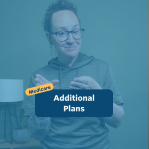 The post has a video thumbnail with blue shading overlaid. The top middle has "Medicare: Additional Plans” in white text with light blue background, accompanied by a yellow bubble with “Medicare” in blue. In the video: A nonbinary person with long, curly brown hair that is shaved on the right side of their head and pulled back stands in front of the camera. Behind them is a small light wooden table with a potted plant set against a green wall. They are wearing a green short sleeved sweatshirt and black pants.