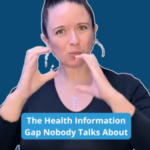 A video frame with a solid blue border surrounding Renca Dunn, a woman with dark hair styled in a high bun stands in front of a grey curtain. She’s wearing a black long-sleeved shirt, silver hoop earrings, and a necklace. She's signing directly to the camera.